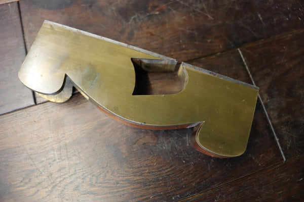 Shoulder/Rebate Plane. Gunmetal with steel sole. Mahogany infill. Small chip to corner of mouth as shown. 46278