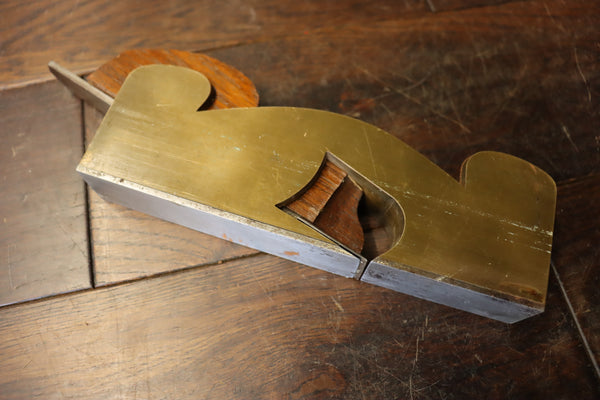 Shoulder/Rebate Plane. Gunmetal with steel sole. Mahogany infill. Small chip to corner of mouth as shown. 46278