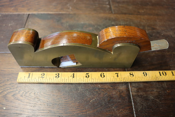 Shoulder/Rebate Plane. Gunmetal with steel sole. Mahogany infill. Small chip to corner of mouth as shown. 46278