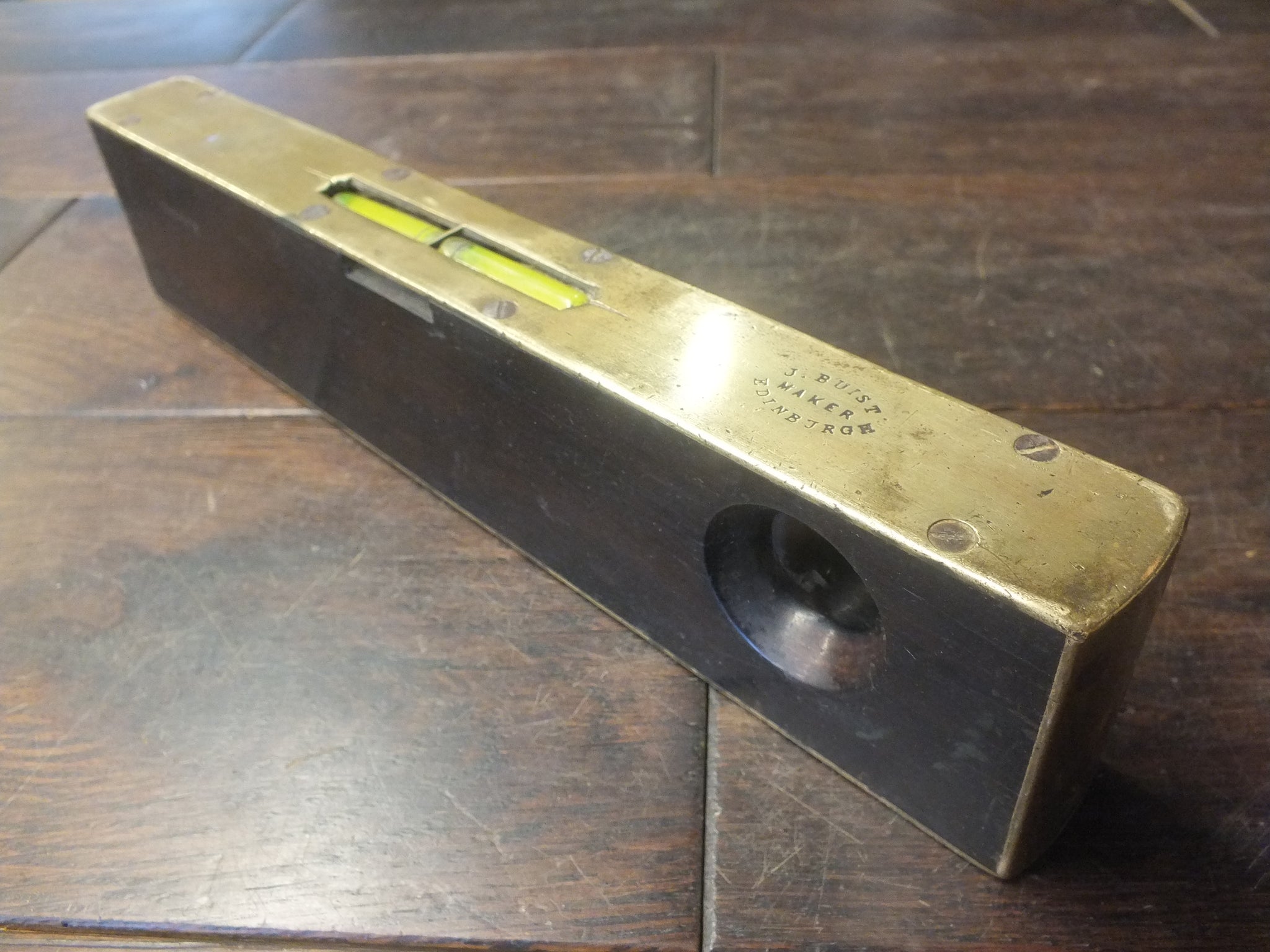 Sighting Level. In original metal case. J Buist, Edinburgh. Full working order with both bubbles fully working. Brass and rosewood. Very exciting sighting.  46294
