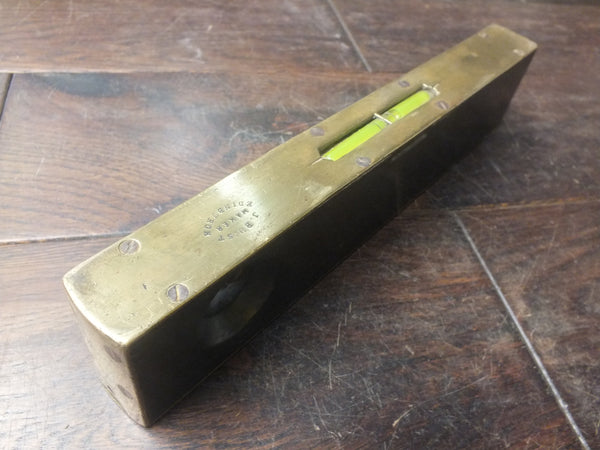 Sighting Level. In original metal case. J Buist, Edinburgh. Full working order with both bubbles fully working. Brass and rosewood. Very exciting sighting.  46294