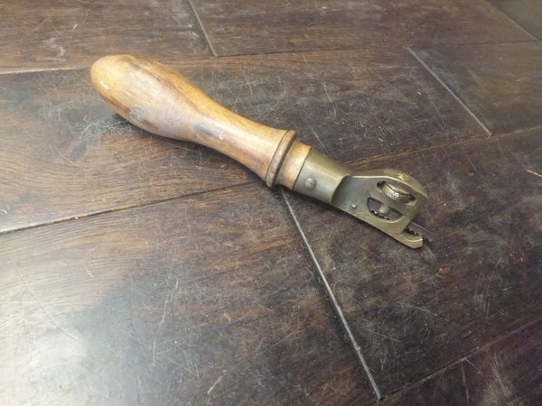 Pad Saw Handle and blade. Cast brass and beech. A tool of great beauty and ingenuity. 46305