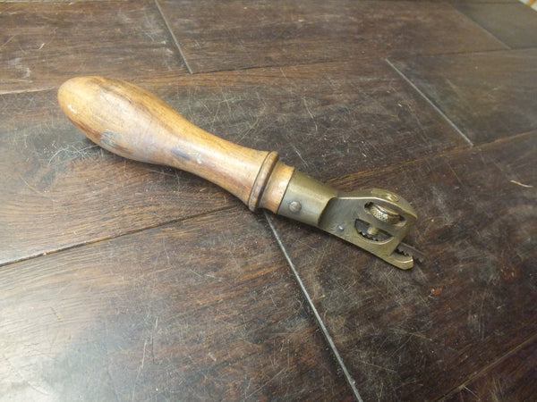 Pad Saw Handle and blade. Cast brass and beech. A tool of great beauty and ingenuity. 46305