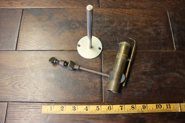 Jeweller's Blow Lamp. Beautiful turned brass tool with good quality wick inside. It comes with its own clamp but is provided also with an aluminium stand. 46244