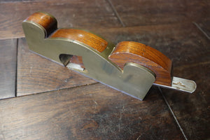 Shoulder/Rebate Plane. Gunmetal with steel sole. Mahogany infill. Small chip to corner of mouth as shown. 46278